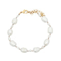 Bracelet doré alternance de petites et grandes perles de culture fil beige