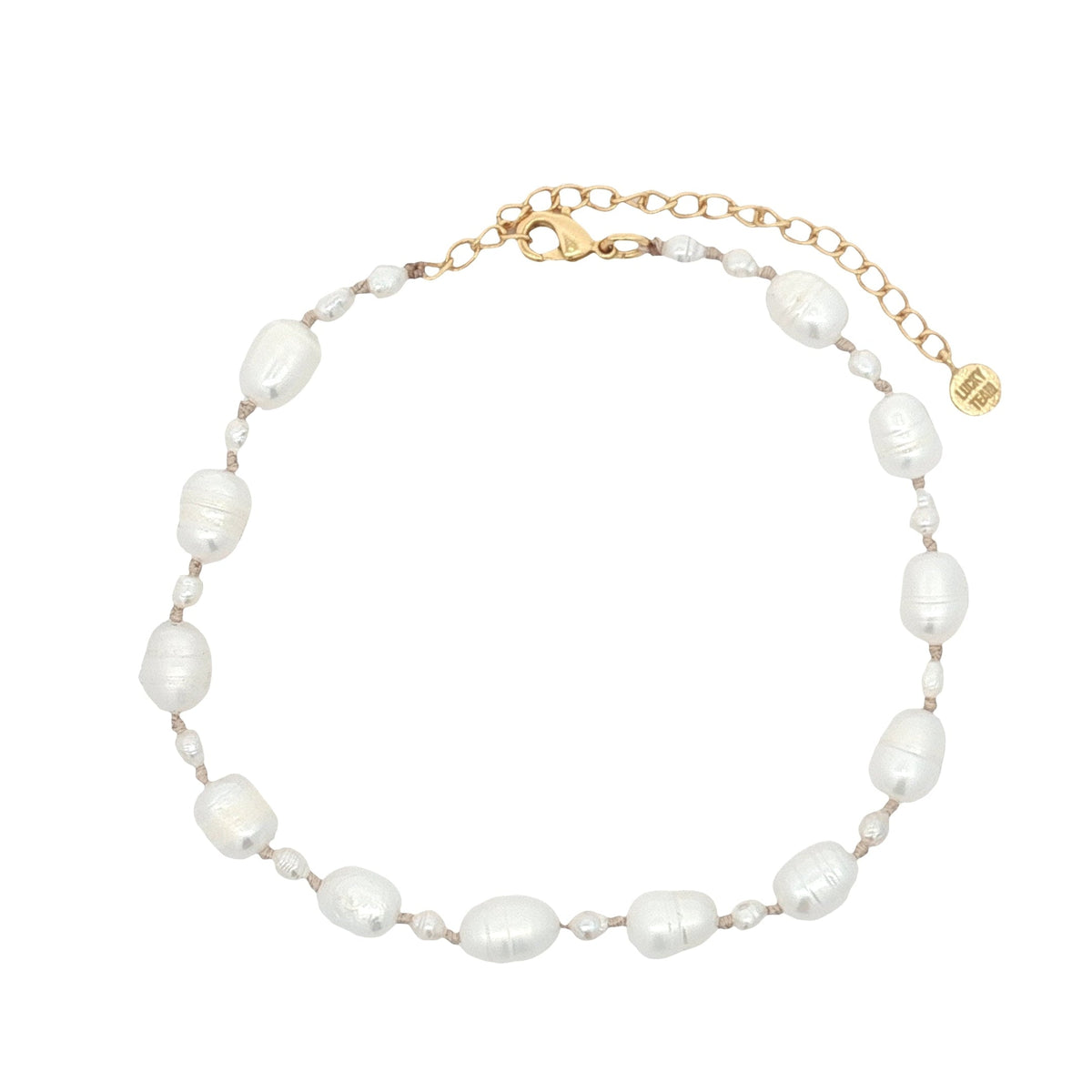 Chaine de cheville dorée petites et grandes perles de culture fil beige