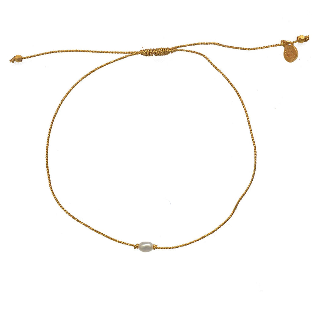 Bracelet tressé doré et perle