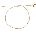 Bracelet tressé doré et perle