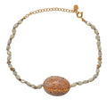 Bracelet de cheville doré et coquillages