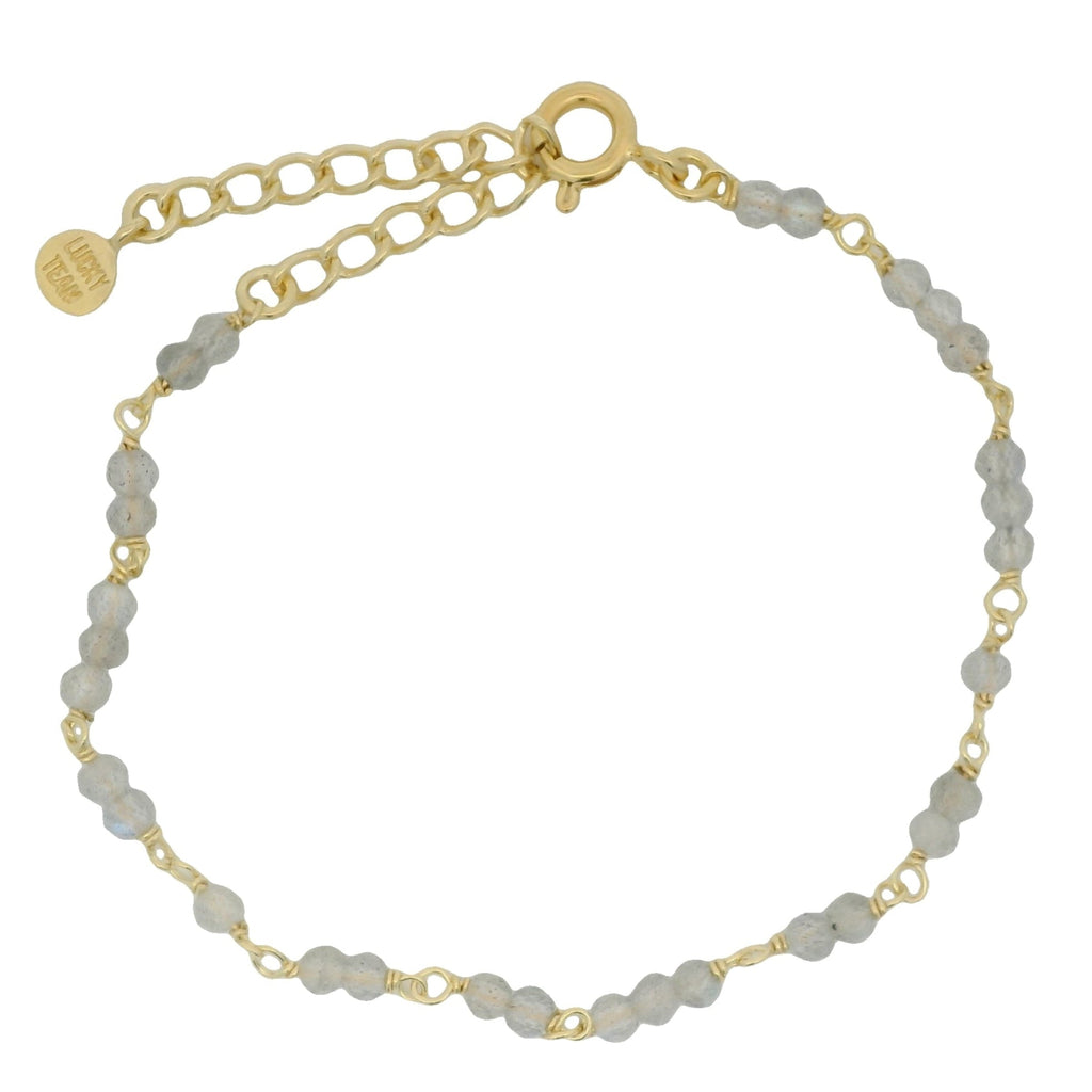 Bracelet doré et petites pierres en labradorite