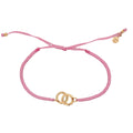 Bracelet cordon rose menottes dorées