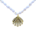Collier doré coquillage et zircons 80 cm