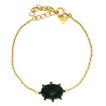 Bracelet doré pierre ovale et zircons