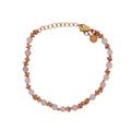 Bracelet doré perles fantaisie roses avec couronnes dorées et noeuds