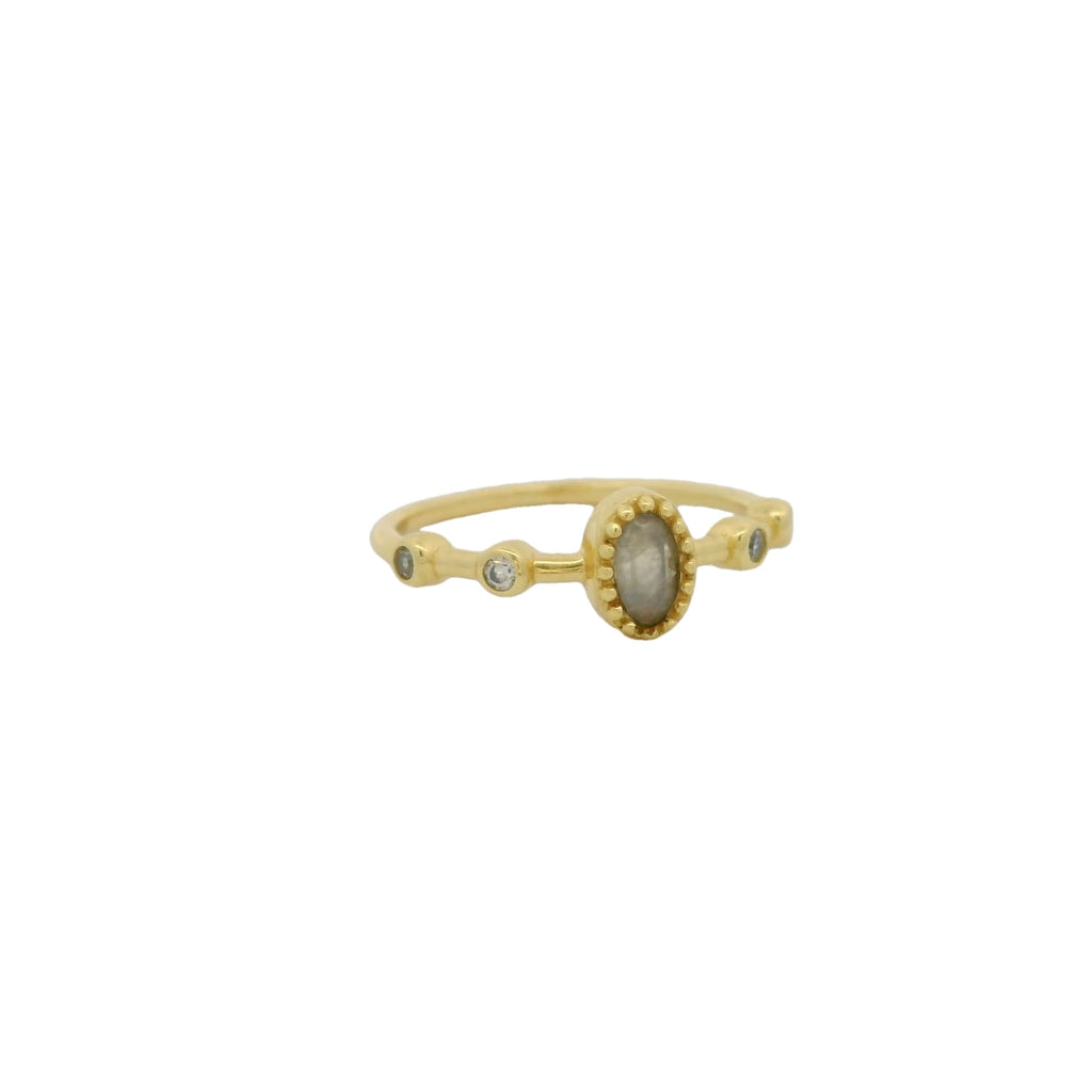Bague dorée pierre ovale et zircons