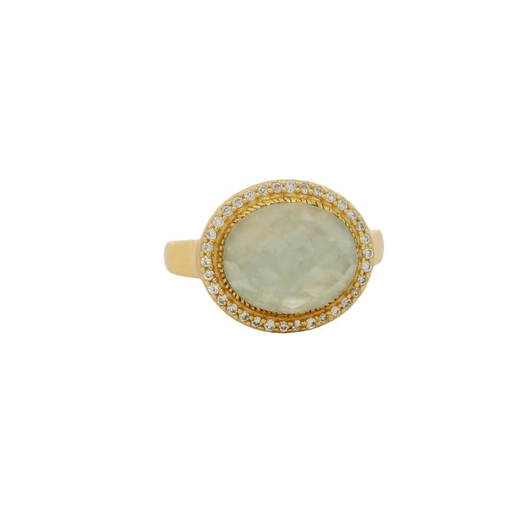 Bague dorée pierre ovale facettée et zircons